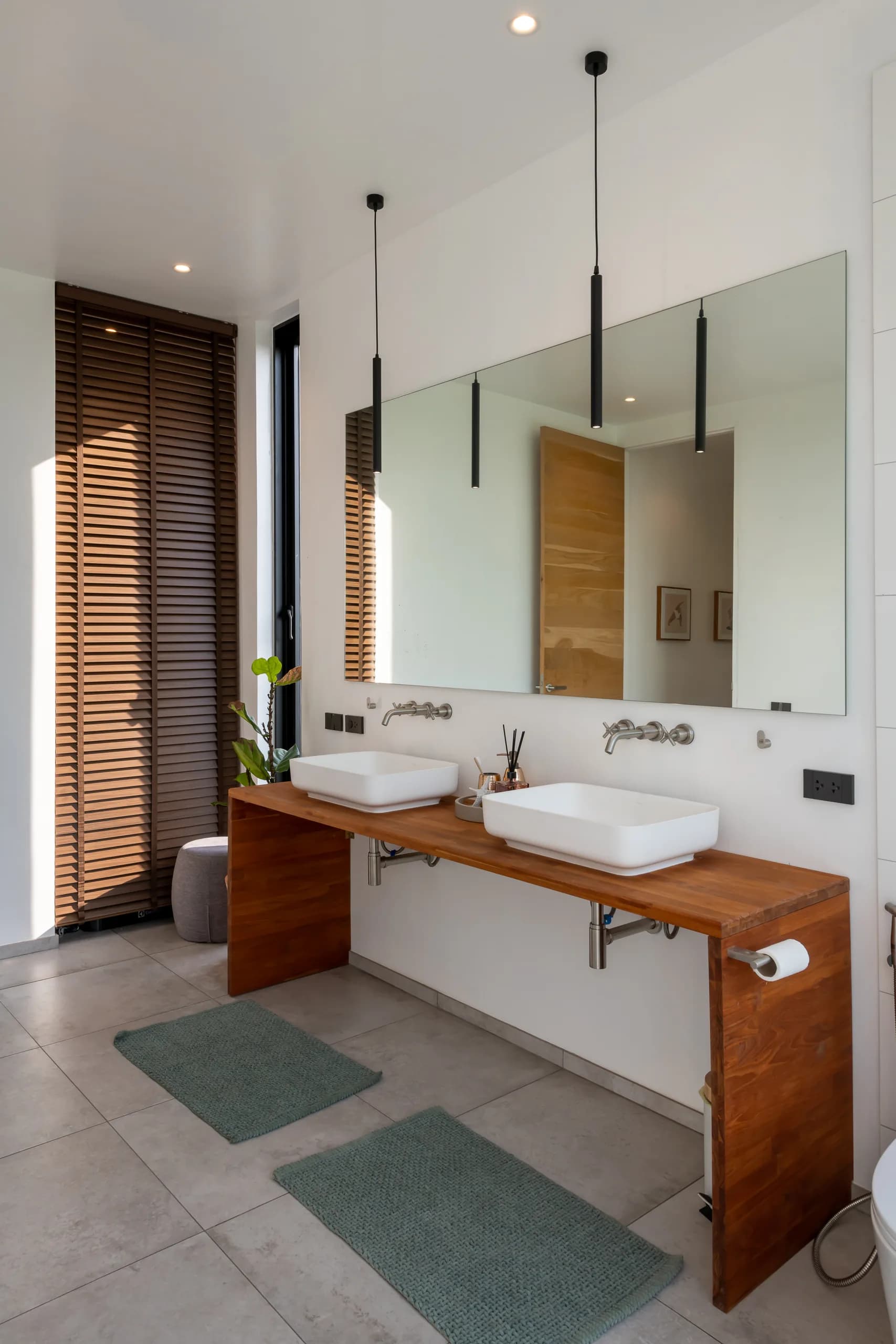 Steel House, ensuite bathroom with twin vessel sinks on a timber vanity